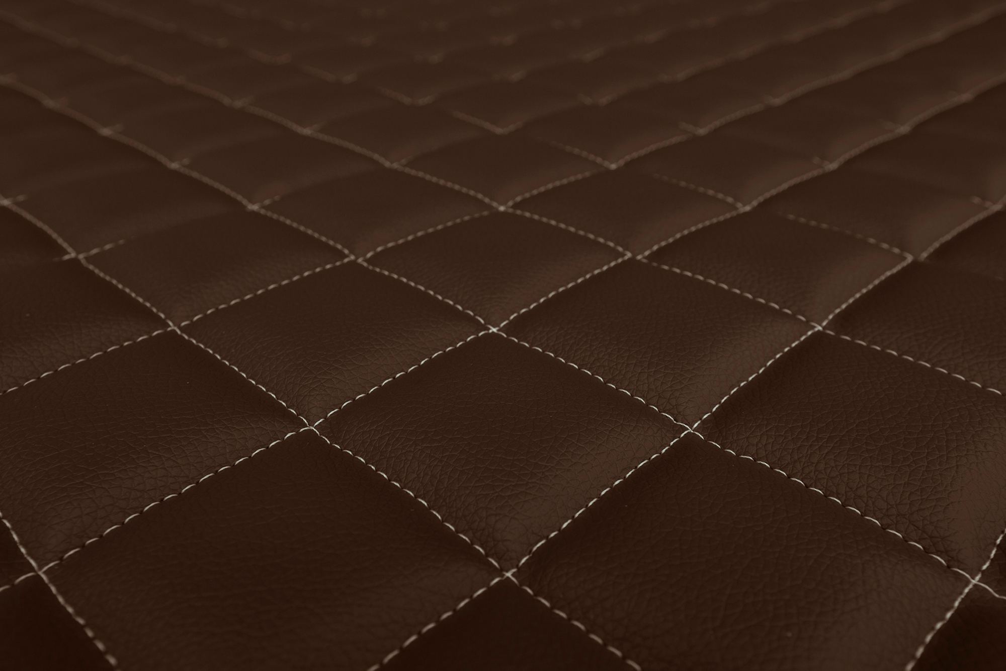 Detail povrchu a prošívání potahů ELEGANCE Q: Hnědá
